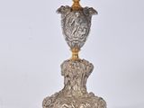 a silver and gold table with a bowl on top of it