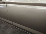 a close up of a car door with the door handle missing