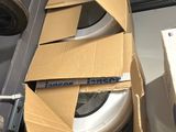 a cardboard box that is sitting on top of a shelf