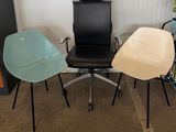 three chairs sitting next to each other in a room