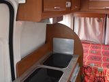 a small kitchen in the back of a camper