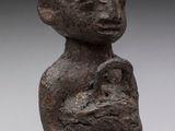 an image of a statue of a person holding a baby