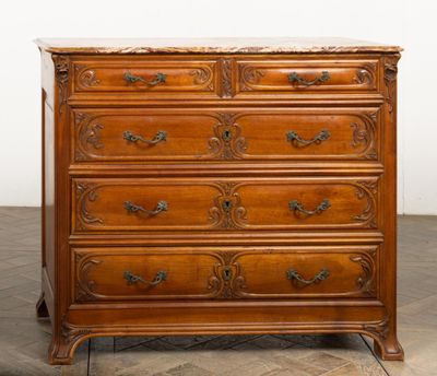 an antique wooden chest of drawers with marble top