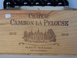 a wooden box that has some bottles of wine in it