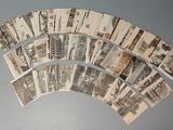 a lot of old black and white photos on a table