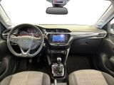 the interior of a small car with a steering wheel and dashboard
