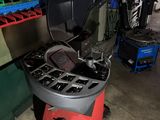 a machine that is sitting in a garage with tools
