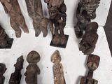 a lot of wooden figurines that are on a table