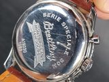 a close up of a person ' s hand holding a watch