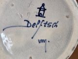 a close up of a cup and saucer on a table