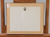 an old wooden easel with a painting on top of it