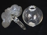 a clear glass vase and a clear glass vase on a black surface