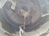 a large metal object that is in the middle of the ground