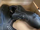 a box with a pair of black shoes inside of it
