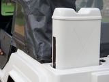 a cooler sitting on top of the back of a truck