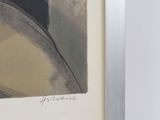 framed photograph of a man in a hat and a hat on a chair