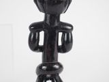an image of a small wooden figurine of a man