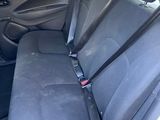 the back seats of a car with a seat belt in the back