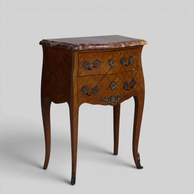 an image of a small chest of drawers with a marble top