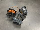 two reels that are sitting on the floor next to each other