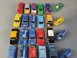 a lot of toy cars that are on the table