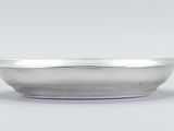 silver plated bowl on a white background with a light gray background