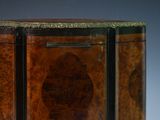 a small wooden cabinet with a mirror on top of it