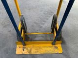 a pair of wheels attached to a yellow cart