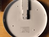 a white plate that is sitting on a table next to a bottle