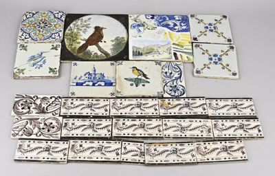 a lot of tiles with birds on them on a table