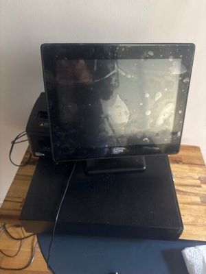 a laptop computer sitting on top of a wooden desk