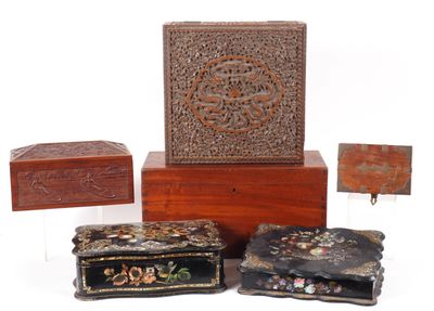 three boxes and a box with a design on them on a white surface