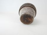 an image of a silver vase sitting on top of a white table
