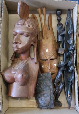 a box with a variety of african masks in it