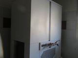 an image of a kitchen with a microwave on top of it