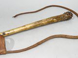 an old wooden stick with a rope on it