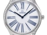 a close up of a watch with roman numerals on the face