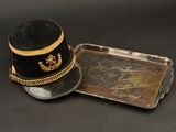 a hat and a tray on a black table