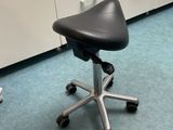 an image of a chair in a room with drawers