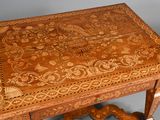 a wooden table with an intricate design on it