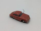 a toy car that is sitting on a white surface