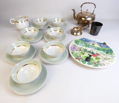 a lot of tea cups and saucers on the table