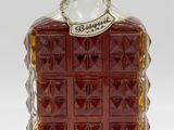 an image of a bottle of liquor sitting on a white surface