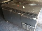 an image of a commercial kitchen with a stainless steel counter top