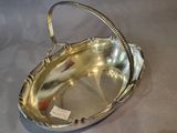 a silver tray with a handle on a table