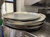 several plates stacked on top of each other on a kitchen counter