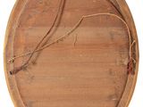 an old wooden plaque with a rope hanging from it ' s side