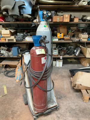 a red fire extinguisor sitting in a garage