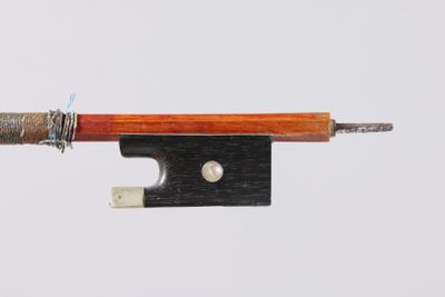 a bow that is attached to a piece of wood