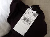 a tag on a pillow that is on a pillow